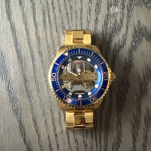 Invicta Gold and Blue Dive Watch with Rotating Bezel